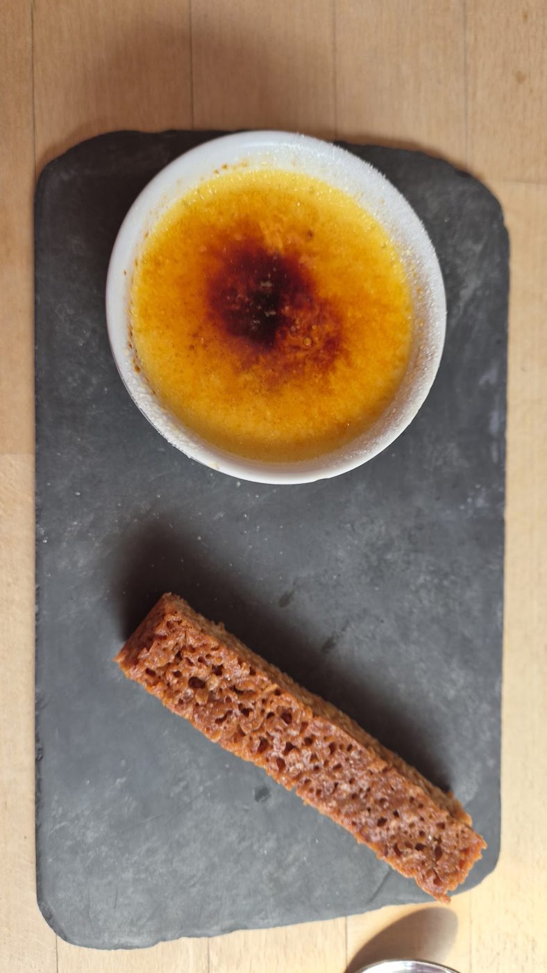 A crème brûlée with a slice of flapjack