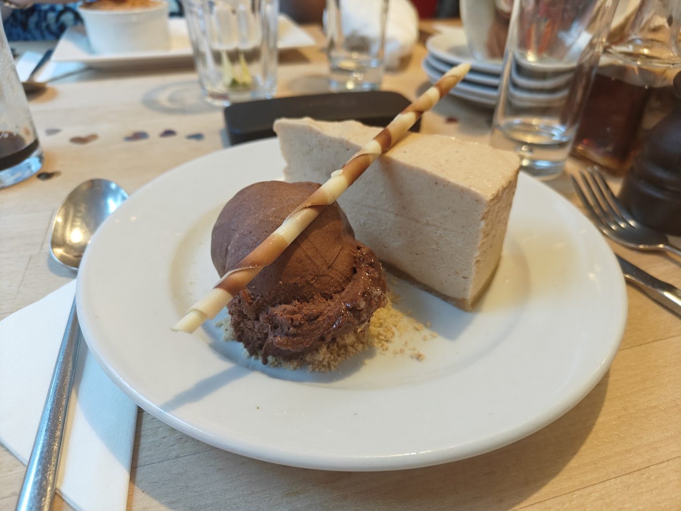 Chocolate ice cream and a slice of cheesecake
