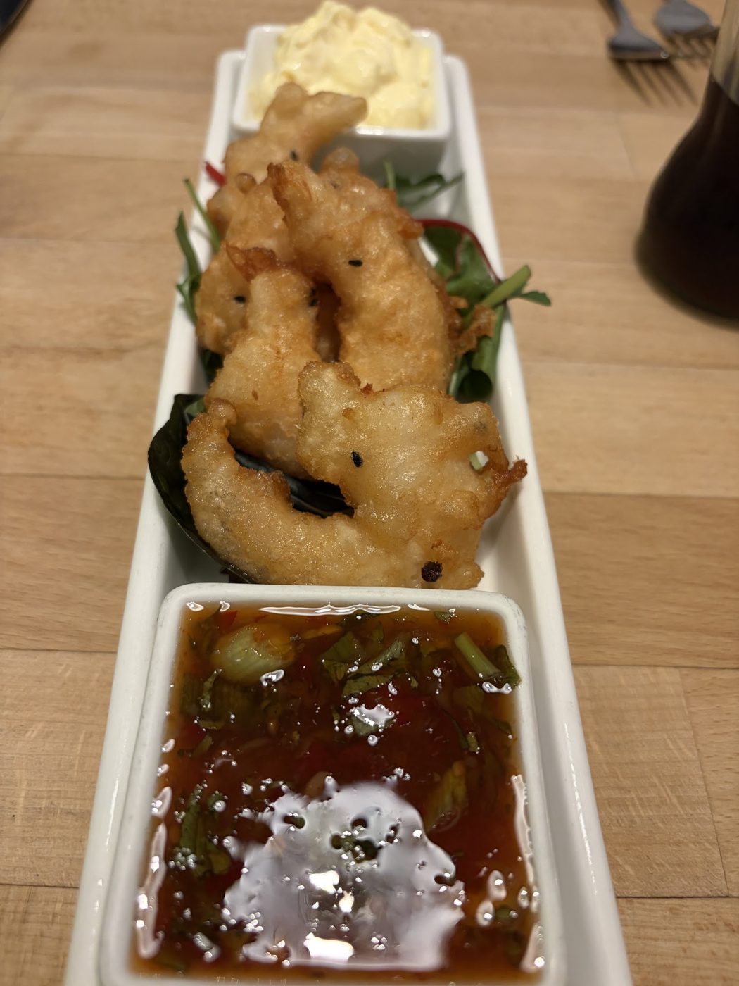 Battered prawns with a dipping sauce